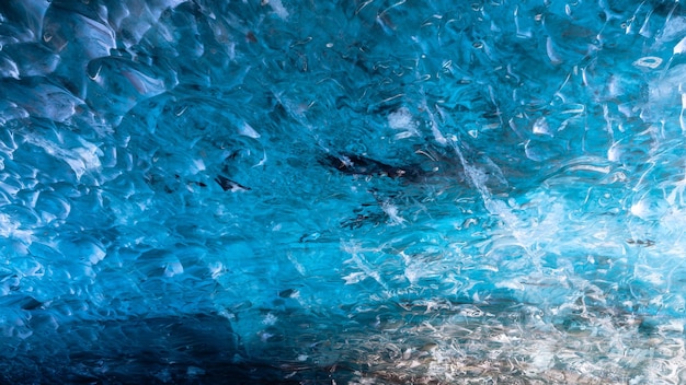 The Crystal Ice Cave in Iceland Ice as a background Vatnajokull National Park Inside view of the ice cave Winter landscapes in Iceland Natural background North country