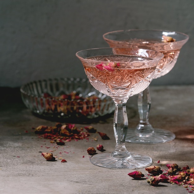 Crystal vintage glasses of pink rose champagne