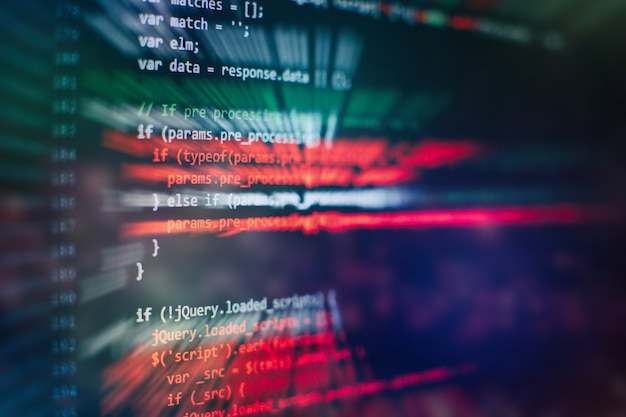 CSS, JavaScript and HTML usage. Monitor closeup of function source code. Abstract IT technology background. Software source code.