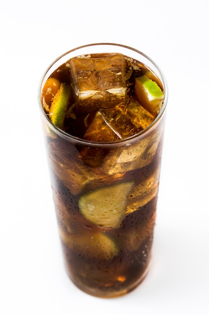 Cuba libre Cocktail with rum, lime and ice isolated on white.