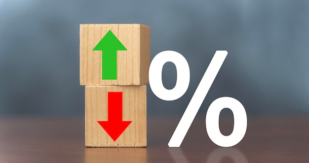 Cube block with percentage symbol icon Interest rate financial and mortgage rates concept Wood cube change arrow down to up Interest rate stocks ranking