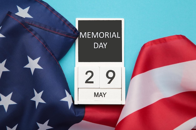 Cube calendar with date 29 May of Memorial Day with USA flag on blue background