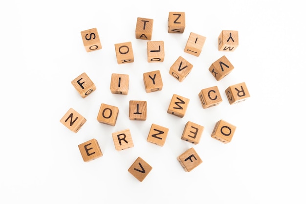 Photo cube letters on a wooden table as a background