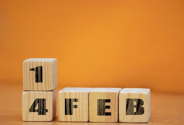 Cube shape calendar for february 14 on wooden surface with empty space for text new year Wooden calendar with date February cube calendar on wooden surface with copy space