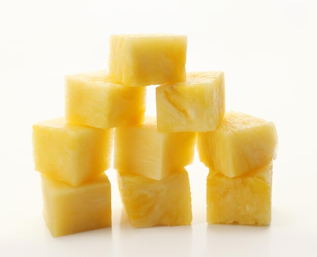 Cubes of canned pineapple isolated on white