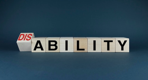 Cubes form the words Disability or Ability Disability concept