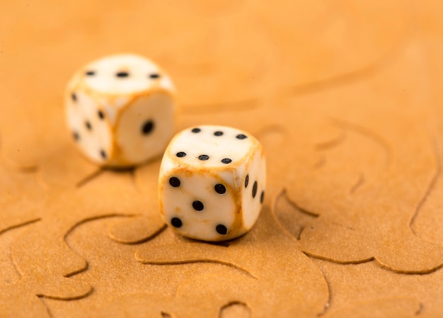 Cubes and game pieces on a backgammon board.