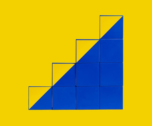 Cubes in stairs form Professional development and growth success and progress concept Career ladder from yellow and blue blocks