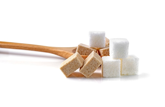 Cubes of sugar cane brown and white isolated on white background