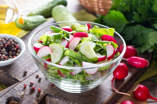 Cucumber and radish salad in a glass plate. Healthy food, diet food