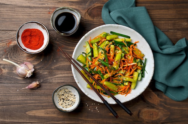 Cucumber salad with carrots and sesame seeds. Asian cuisine