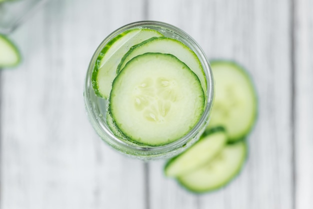 Cucumber Water on vintage wooden background