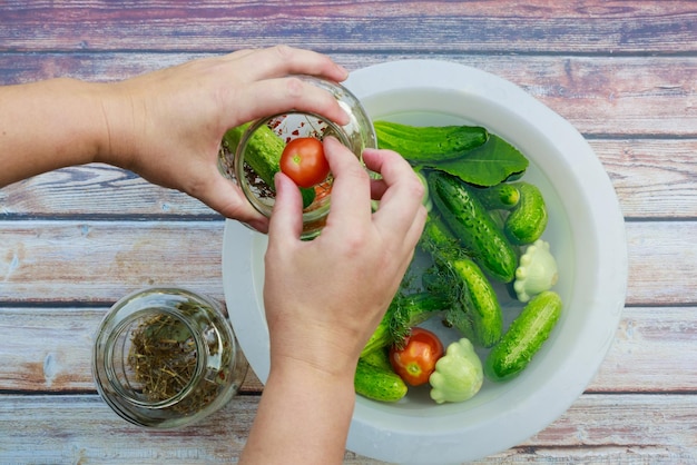 Cucumbers and squash are ready for pickling in glass jars