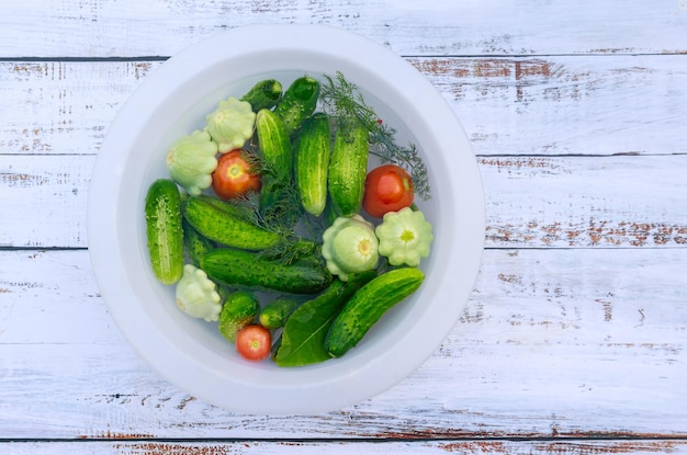 Cucumbers tomatoes and squash are ready to pickle