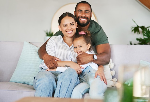 Cuddling up to a carefree day Portrait of a happy family relaxing together at home