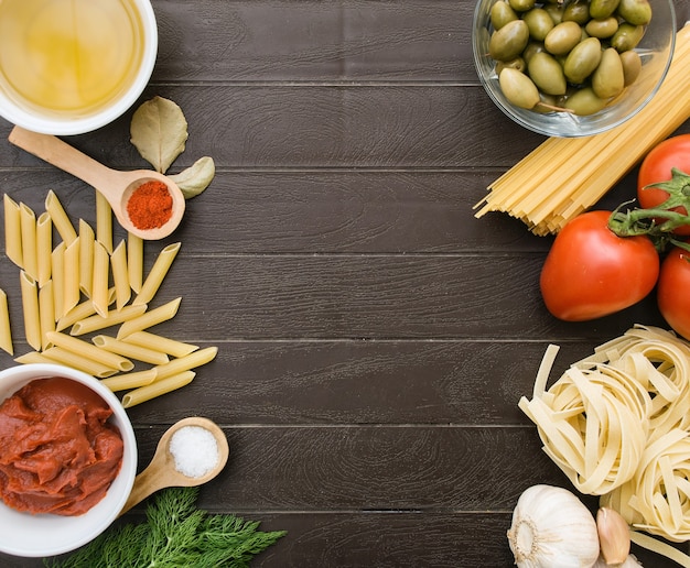 Culinary background for recipes. Frame from ingredients for cooking Italian pasta. Grocery shopping list, recipe book, diet or vegan food.