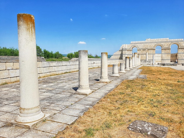 Cultural heritage of the romans concept ancient roman atrium with columns and walls with mosaic