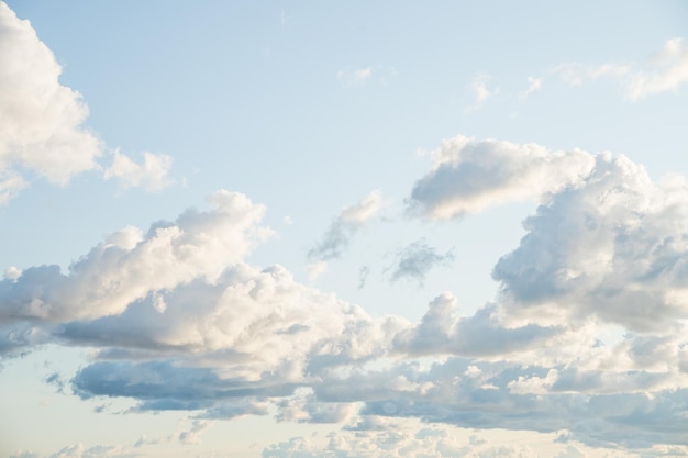 Cumulus white clouds floating on blue sky in beautiful morningsunny weather skywards landscape for b