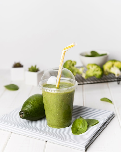 Cup of avocado and spinach smoothie