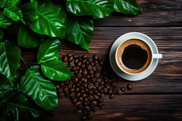 Cup of black coffee green leaves and beans on rustic wooden table top view