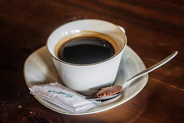 a cup of black coffee premium photo