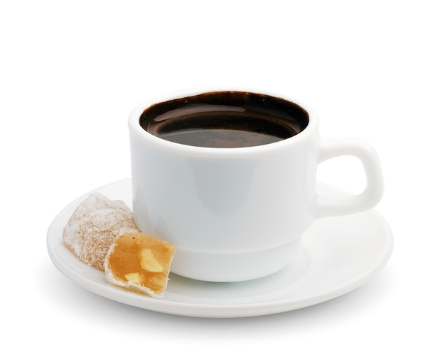 Cup of black coffee with turkish delight. Isolated