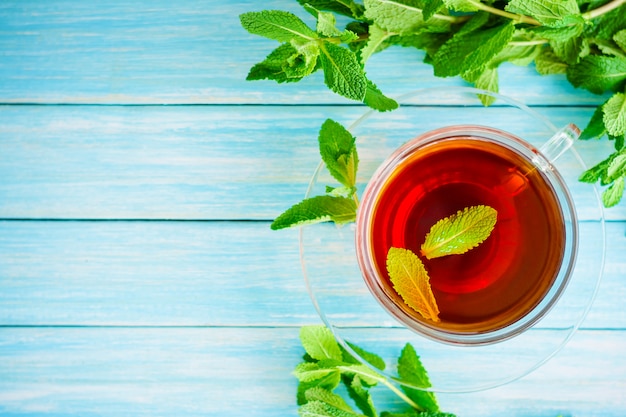 Cup of black tea with fresh mint