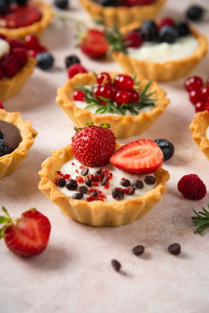 Cup cakes with composition on white backround mixed fruits