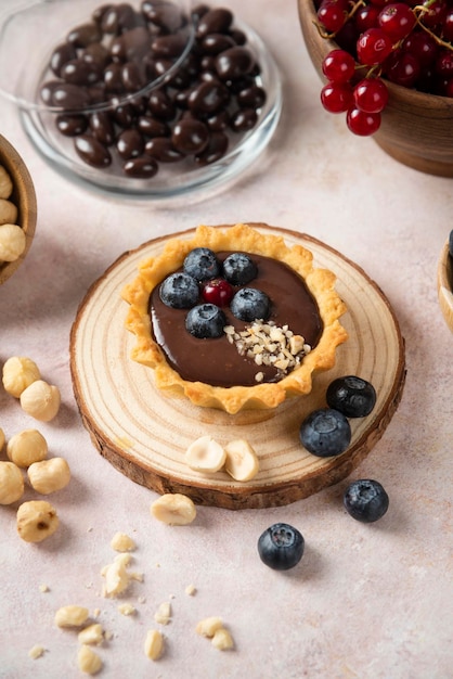 Cup cakes with composition on white backround mixed fruits