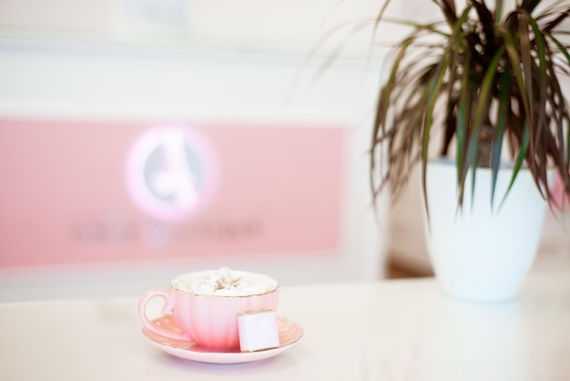 A cup of cappuccino for a client in a beauty salon