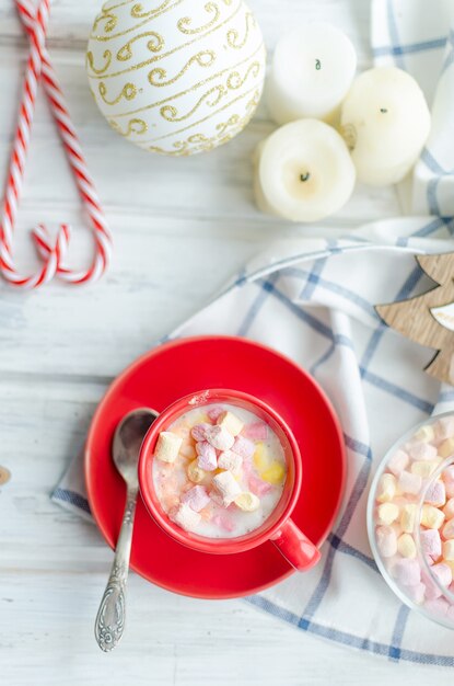 Cup of cocoa with marshmallows with fruit pastille and chips