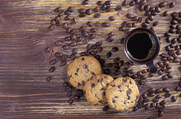 Cup of coffee, beans and cookies