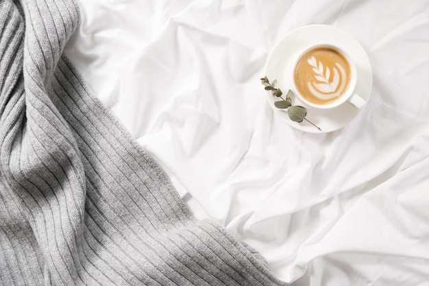 Cup of coffee in bed