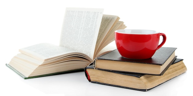 Cup of coffee and books isolated on white