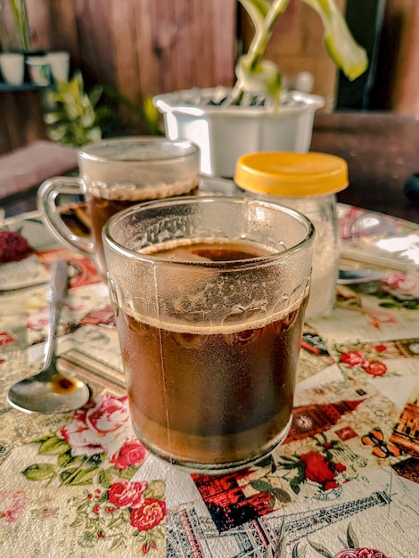 A cup of coffee on a Close Up Photography table