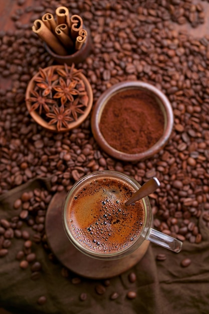 Cup Of Coffee And Coffee Beans On Table