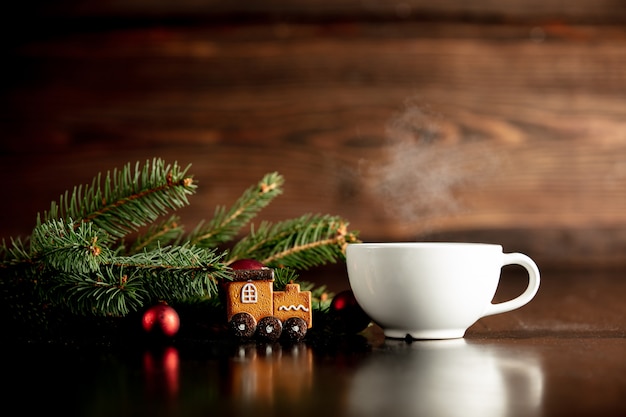 Cup of coffee and gingerbread cookie on a table