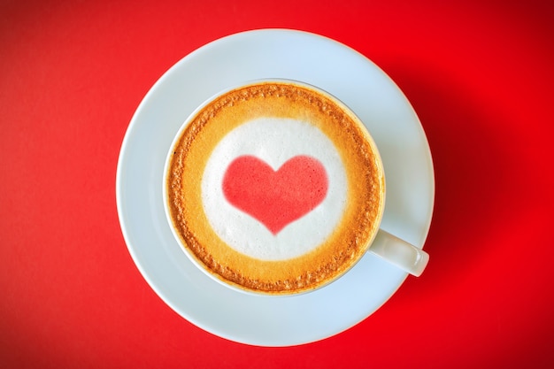 Photo cup of coffee,heart drawing on coffee