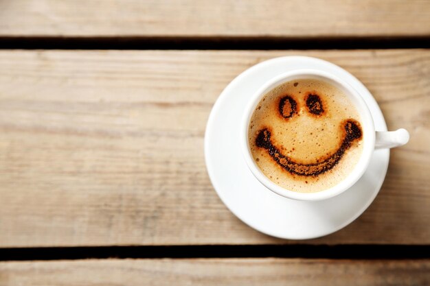 Cup of coffee on old wooden table