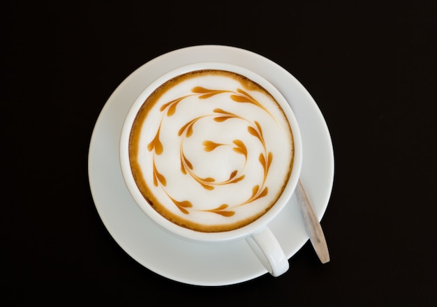 cup of coffee on table, view from above