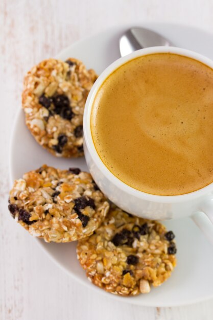 Cup of coffee with cookies