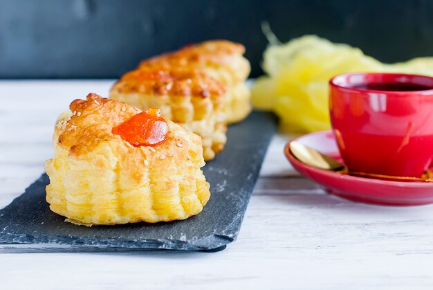 Cup of coffee with  flaky pastry desert