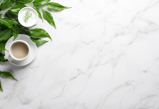 a cup of coffee with a green plant on the table