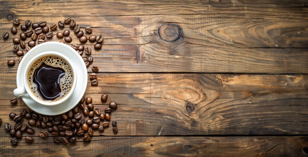 Cup of coffee with rich aroma surrounded by roasted beans