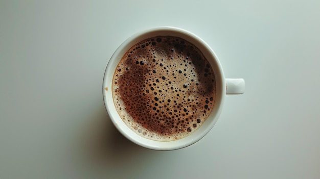 a cup of coffee with a small amount of foam on the top