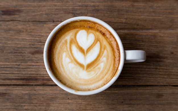 cup of coffee on wood table blackground