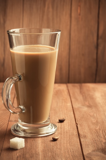 Cup of coffee on wooden surface