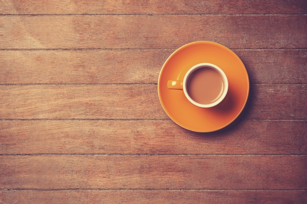 Cup of coffee on a wooden table.