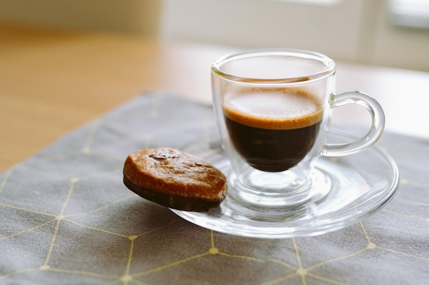 Cup of espresso coffee with chocolate gingerbread