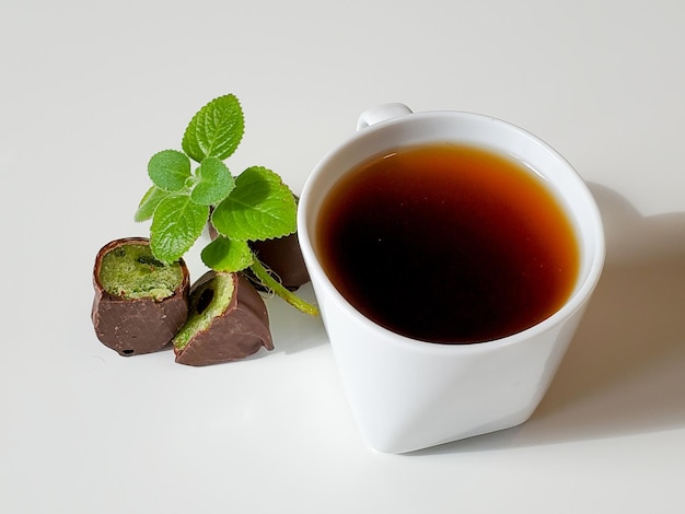 Cup filter coffee and mint chocolates beautiful sweets for breakfast dessert